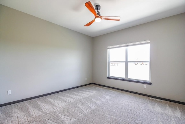 1600 Heartland St, Fairfax, IA 52228 - empty room featuring carpet and ceiling fan