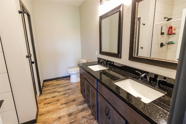 1600 Heartland St, Fairfax, IA 52228 - full bathroom with wood finished floors and double vanity