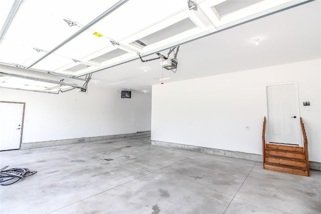 1600 Heartland St, Fairfax, IA 52228 - garage featuring a garage door opener