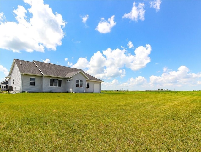 1600 Heartland St, Fairfax, IA 52228 - back of property featuring a lawn and a shingled roof