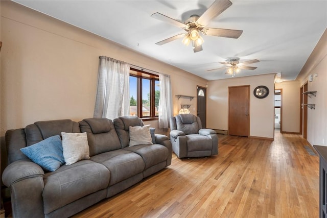 2469 1st St SW, Cedar Rapids, IA 52404 - living area with ceiling fan and light wood finished floors
