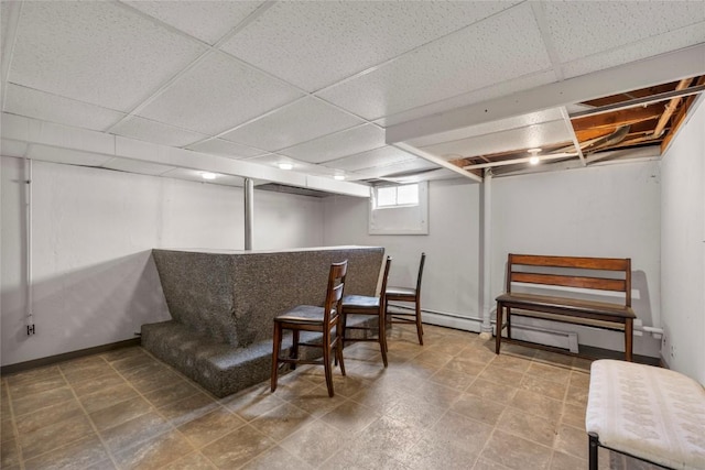 2469 1st St SW, Cedar Rapids, IA 52404 - basement with a baseboard radiator, a drop ceiling, and bar area