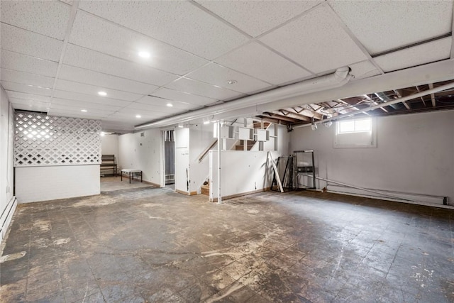 2469 1st St SW, Cedar Rapids, IA 52404 - basement featuring stairway and a paneled ceiling