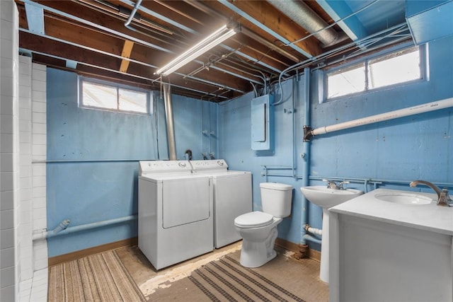 2469 1st St SW, Cedar Rapids, IA 52404 - laundry area featuring washer and dryer and plenty of natural light