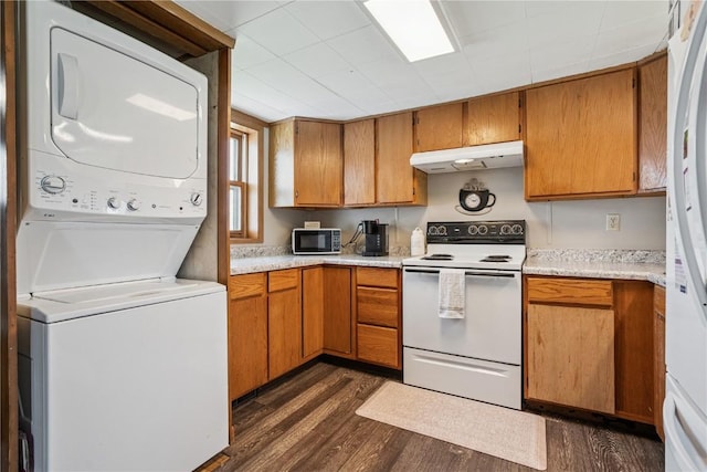 409 Railroad St, Fairfax, IA 52228 - kitchen with white appliances, under cabinet range hood, stacked washer and clothes dryer, and dark wood-style floors