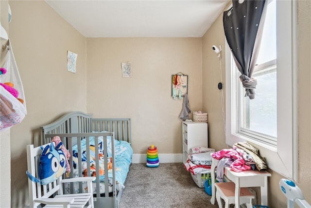 409 Railroad St, Fairfax, IA 52228 - carpeted bedroom featuring baseboards