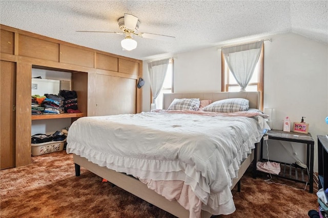 409 Railroad St, Fairfax, IA 52228 - bedroom featuring carpet, a textured ceiling, vaulted ceiling, and ceiling fan