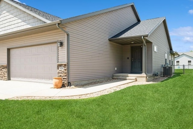 5616 Dostal Dr SW, Cedar Rapids, IA 52404 - view of front of house with an attached garage, driveway, and a shingled roof