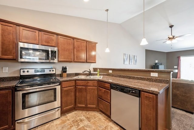 5616 Dostal Dr SW, Cedar Rapids, IA 52404 - kitchen with stainless steel appliances, a peninsula, lofted ceiling, open floor plan, and a ceiling fan