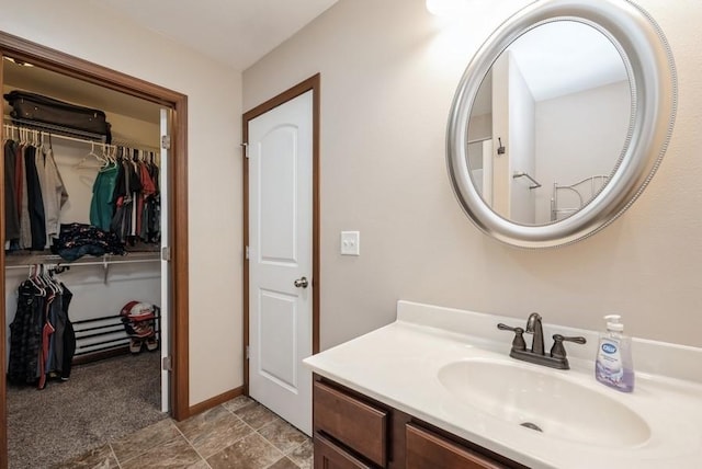 5616 Dostal Dr SW, Cedar Rapids, IA 52404 - bathroom featuring vanity and a spacious closet