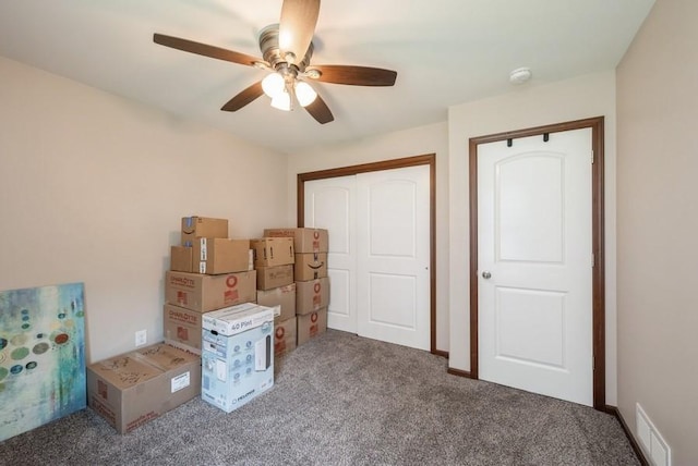 5616 Dostal Dr SW, Cedar Rapids, IA 52404 - unfurnished bedroom with carpet flooring, a closet, and a ceiling fan
