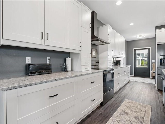 5112 Scenic View Ct SW, Cedar Rapids, IA 52404 - kitchen featuring electric stove, wall chimney range hood, white cabinetry, dark wood-style flooring, and recessed lighting