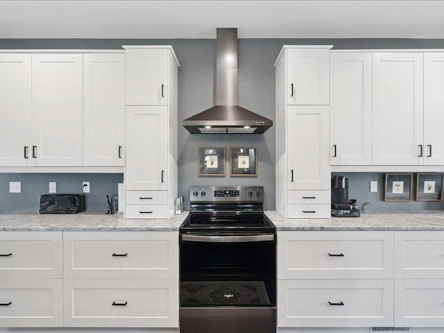 5112 Scenic View Ct SW, Cedar Rapids, IA 52404 - kitchen with wall chimney exhaust hood, electric range, white cabinetry, and light stone counters