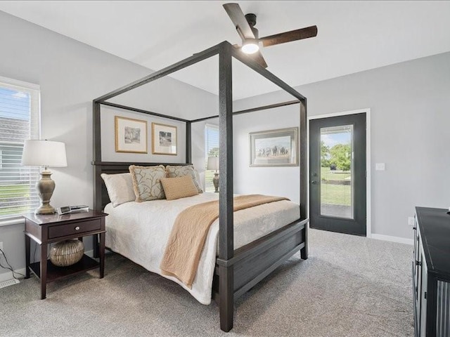 5112 Scenic View Ct SW, Cedar Rapids, IA 52404 - carpeted bedroom with ceiling fan and access to exterior