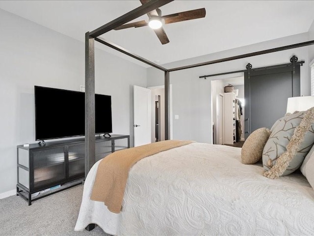 5112 Scenic View Ct SW, Cedar Rapids, IA 52404 - bedroom with carpet flooring, a barn door, and ceiling fan