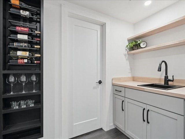 5112 Scenic View Ct SW, Cedar Rapids, IA 52404 - bar featuring recessed lighting and dark wood-style flooring
