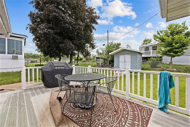 200 Drexel Dr SW, Cedar Rapids, IA 52404 - deck featuring outdoor dining space, grilling area, and a storage shed