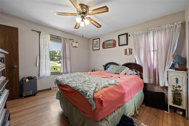 200 Drexel Dr SW, Cedar Rapids, IA 52404 - bedroom with light wood-type flooring and a ceiling fan