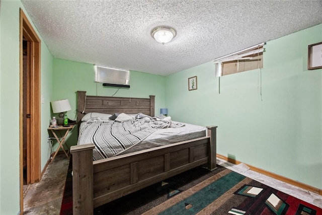 200 Drexel Dr SW, Cedar Rapids, IA 52404 - bedroom with a wall mounted air conditioner and a textured ceiling