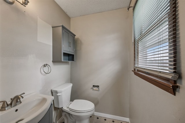 805 W 17th St, Vinton, IA 52349 - bathroom with a textured ceiling and vanity