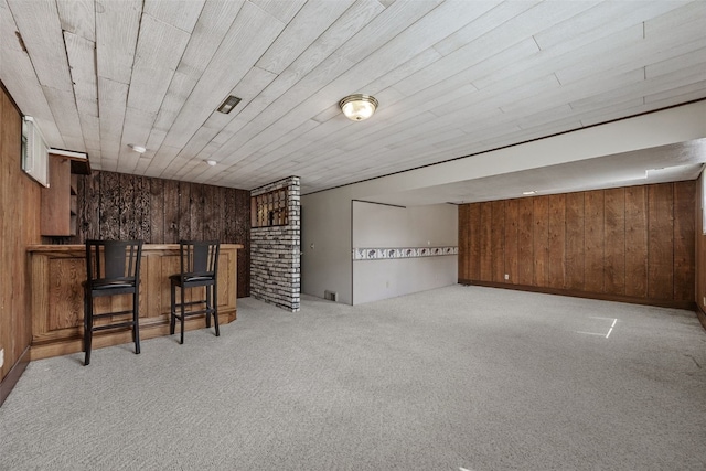 805 W 17th St, Vinton, IA 52349 - indoor dry bar featuring wood walls and light carpet