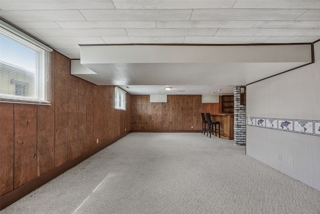805 W 17th St, Vinton, IA 52349 - basement with wood walls, carpet, and bar