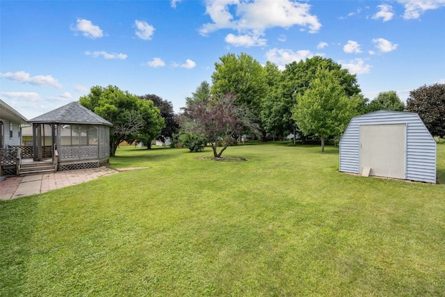 805 W 17th St, Vinton, IA 52349 - view of green lawn featuring a gazebo and a storage unit