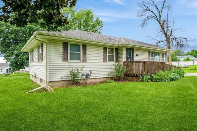819 Valley St, Center Point, IA 52213 - ranch-style home featuring a front yard, a wooden deck, and roof with shingles