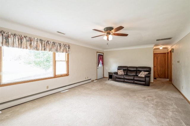 819 Valley St, Center Point, IA 52213 - living room featuring a baseboard heating unit, ceiling fan, and light colored carpet