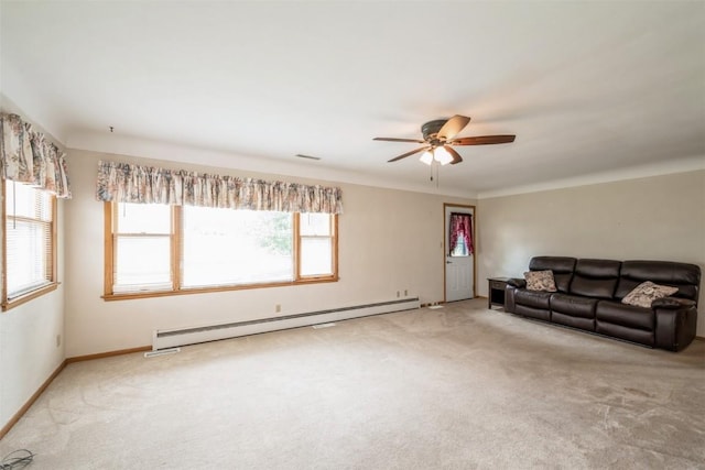 819 Valley St, Center Point, IA 52213 - unfurnished living room with a baseboard radiator, carpet, and a ceiling fan