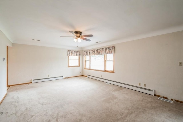 819 Valley St, Center Point, IA 52213 - empty room featuring baseboard heating, ceiling fan, and carpet flooring
