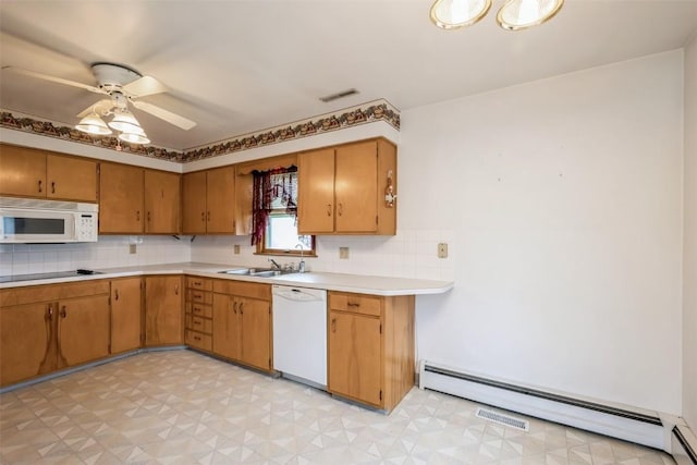 819 Valley St, Center Point, IA 52213 - kitchen featuring white appliances, light floors, baseboard heating, and light countertops