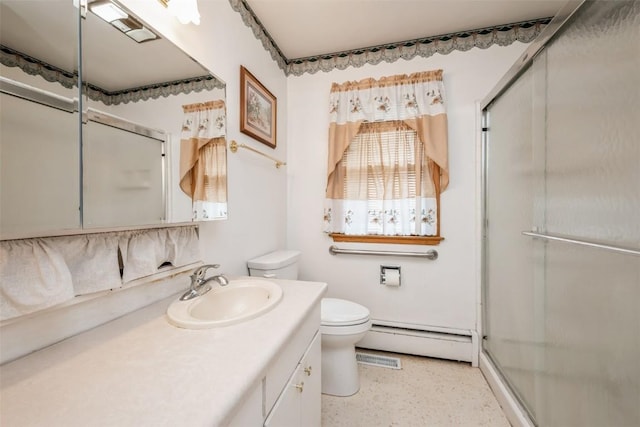 819 Valley St, Center Point, IA 52213 - bathroom with baseboard heating, vanity, a shower with shower door, and speckled floor