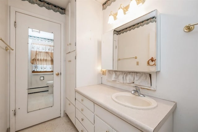 819 Valley St, Center Point, IA 52213 - bathroom with baseboard heating and vanity