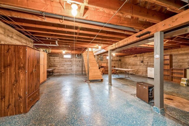 819 Valley St, Center Point, IA 52213 - unfinished basement with stairs and wooden walls