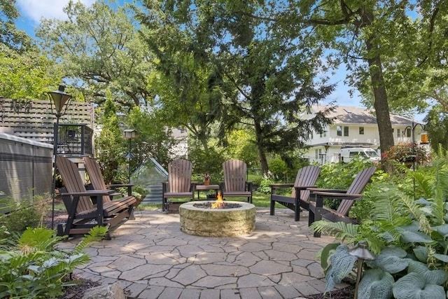 318 Ferson Ave, Iowa City, IA 52246 - view of patio featuring a fire pit