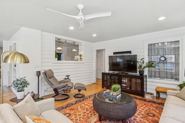 318 Ferson Ave, Iowa City, IA 52246 - living room with wood finished floors, ceiling fan, recessed lighting, and wooden walls