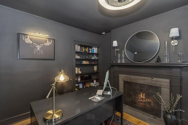 318 Ferson Ave, Iowa City, IA 52246 - office area with a tile fireplace and wood finished floors