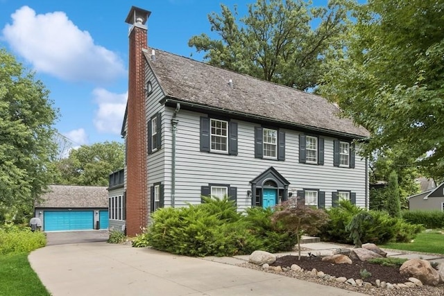318 Ferson Ave, Iowa City, IA 52246 - colonial-style house with a chimney and a garage