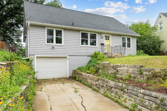 2539 Vernon Ct SE, Cedar Rapids, IA 52403 - view of front facade featuring a garage, driveway, and a shingled roof