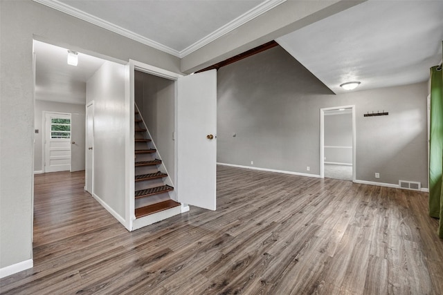 2539 Vernon Ct SE, Cedar Rapids, IA 52403 - basement featuring wood finished floors, stairway, and ornamental molding