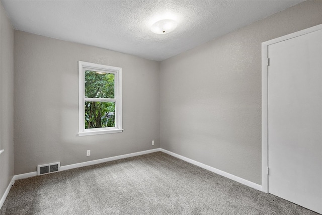 2539 Vernon Ct SE, Cedar Rapids, IA 52403 - carpeted spare room featuring a textured ceiling and baseboards
