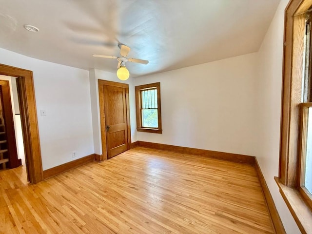 423 S 7th Ave, Iowa City, IA 52245 - spare room featuring light wood-style flooring and a ceiling fan