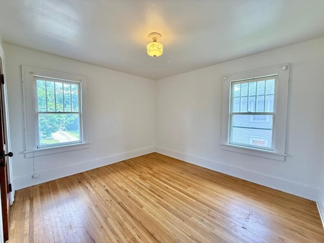 423 S 7th Ave, Iowa City, IA 52245 - spare room featuring light wood finished floors and baseboards