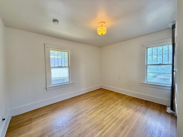 423 S 7th Ave, Iowa City, IA 52245 - spare room with baseboards and light wood-style floors