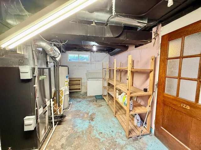 423 S 7th Ave, Iowa City, IA 52245 - basement featuring water heater and heating unit