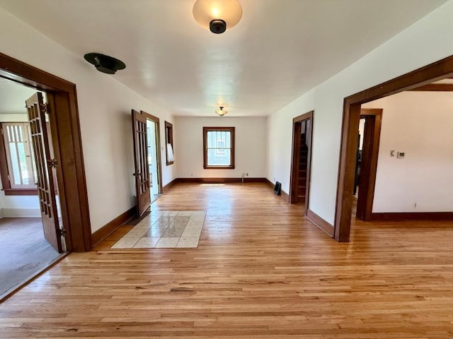 423 S 7th Ave, Iowa City, IA 52245 - spare room featuring light wood-type flooring and french doors