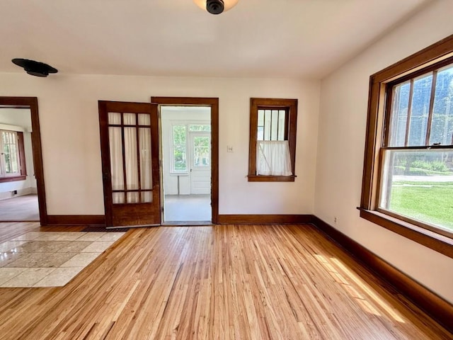 423 S 7th Ave, Iowa City, IA 52245 - empty room with healthy amount of natural light and light wood-type flooring