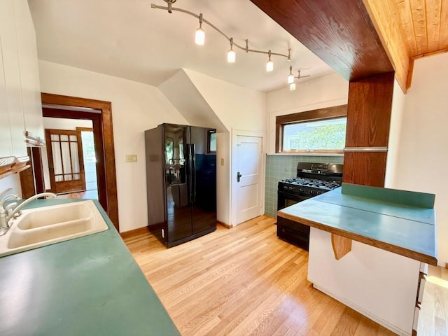 423 S 7th Ave, Iowa City, IA 52245 - kitchen with black appliances and light wood finished floors