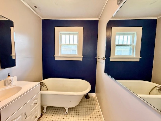 423 S 7th Ave, Iowa City, IA 52245 - full bath featuring healthy amount of natural light, vanity, a freestanding bath, ornamental molding, and tile patterned floors